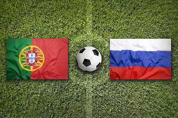 Image showing Portugal vs. Russia flags on soccer field
