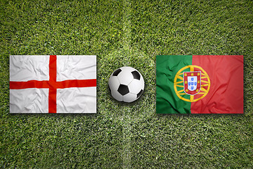 Image showing England vs. Portugal flags on soccer field