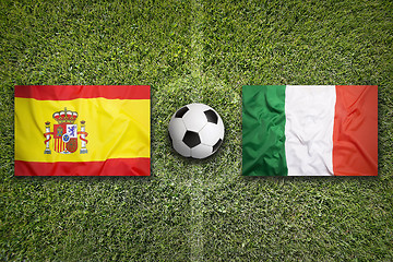 Image showing Spain vs. Italy flags on soccer field