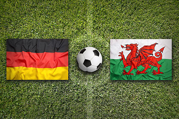 Image showing Germany vs. Wales flags on soccer field