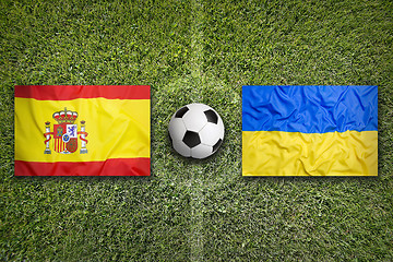 Image showing Spain vs. Ukraine flags on soccer field
