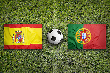 Image showing Spain vs. Portugal flags on soccer field