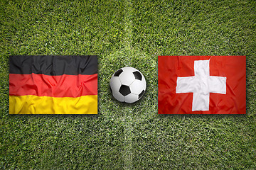 Image showing Germany vs. Switzerland flags on soccer field