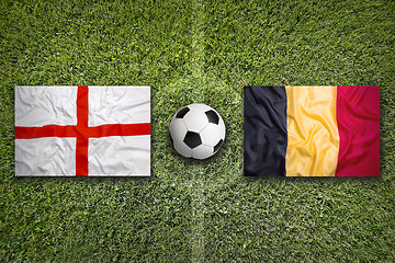 Image showing England vs. Belgium flags on soccer field