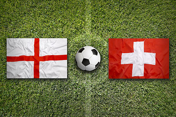 Image showing England vs. Switzerland flags on soccer field