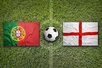 Image showing Portugal vs. England flags on soccer field