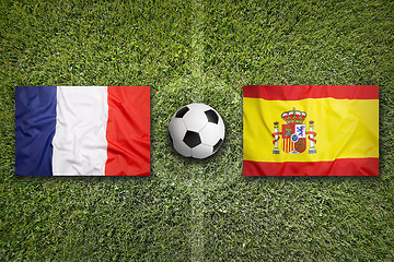 Image showing France vs. Spain flags on soccer field