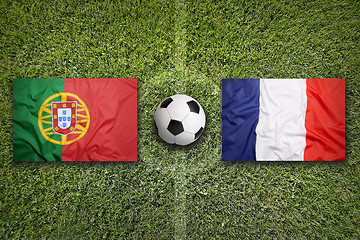 Image showing Portugal vs. France flags on soccer field