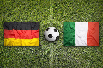 Image showing Germany vs. Italy flags on soccer field