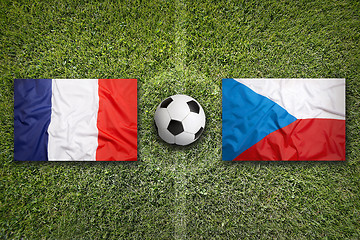 Image showing France vs. Czech Republic flags on soccer field