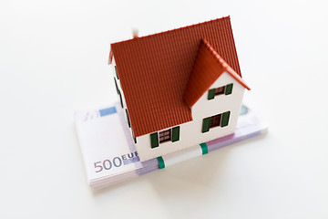 Image showing close up of home or house model and money