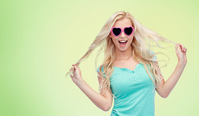 Image showing happy young blonde woman or teenager in sunglasses