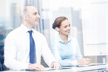 Image showing group of smiling businesspeople meeting in office