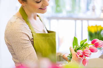 Image showing close up of florist making bunch at flower shop