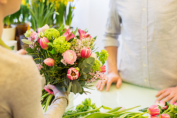 Image showing close up of florist woman and man at flower shop