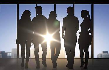Image showing people silhouettes over office background