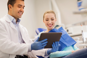 Image showing male dentist with tablet pc and woman patient