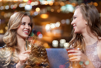 Image showing happy women with drinks at night club