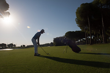 Image showing golf player hitting shot