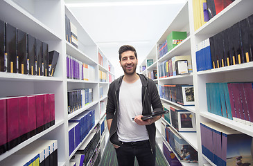 Image showing student with tablet in library