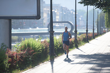 Image showing handsome senior man  jogging