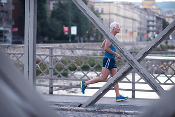 Image showing handsome senior man  jogging