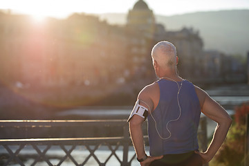 Image showing portrait of handsome senior jogging man