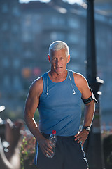 Image showing portrait of handsome senior jogging man