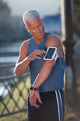 Image showing portrait of handsome senior jogging man