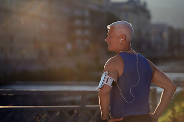 Image showing portrait of handsome senior jogging man