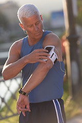 Image showing portrait of handsome senior jogging man