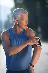 Image showing portrait of handsome senior jogging man