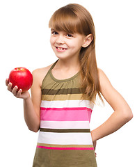 Image showing Little girl with red apple