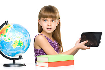 Image showing Young girl is showing tablet
