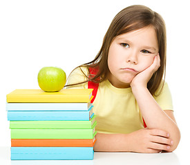 Image showing Little girl with her books