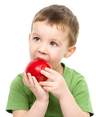 Image showing Portrait of a cute little boy with red apple