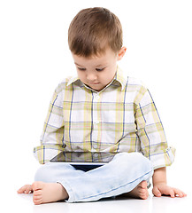 Image showing Young boy is using tablet