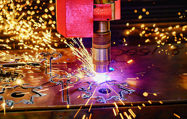 Image showing CNC Laser cutting of metal, modern industrial technology.