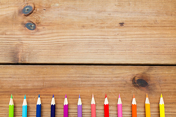 Image showing close up of crayons or color pencils on wood