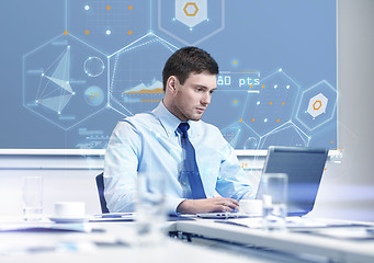 Image showing businessman with laptop working in office