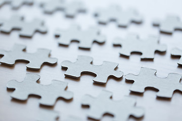 Image showing close up of puzzle pieces on table