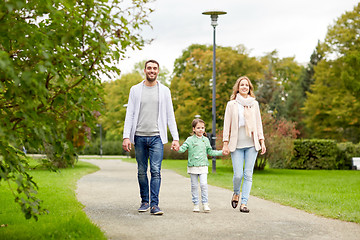 Image showing happy family walking in summer park