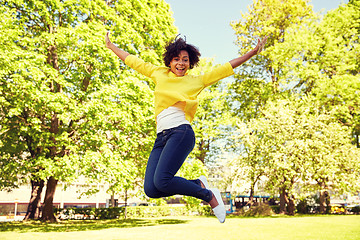 Image showing happy african american young woman in summer park