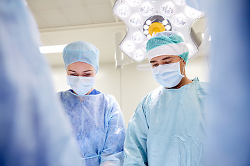 Image showing group of surgeons in operating room at hospital