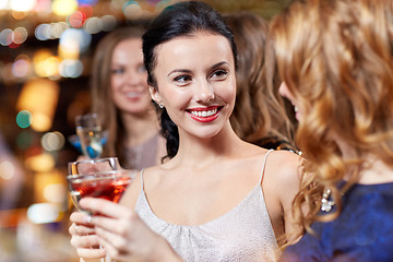 Image showing happy women with drinks at night club