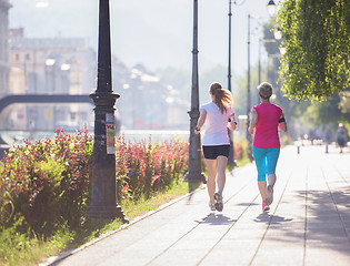 Image showing female friends jogging