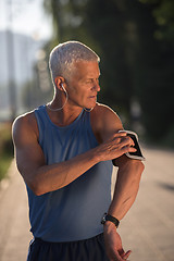 Image showing portrait of handsome senior jogging man