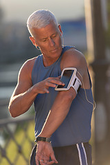 Image showing portrait of handsome senior jogging man