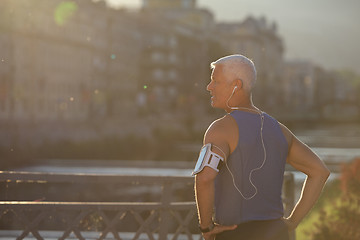 Image showing portrait of handsome senior jogging man