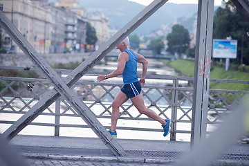 Image showing handsome senior man  jogging